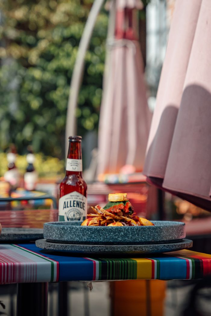Vibrant outdoor setting with Mexican food and beer in Ciudad de México.